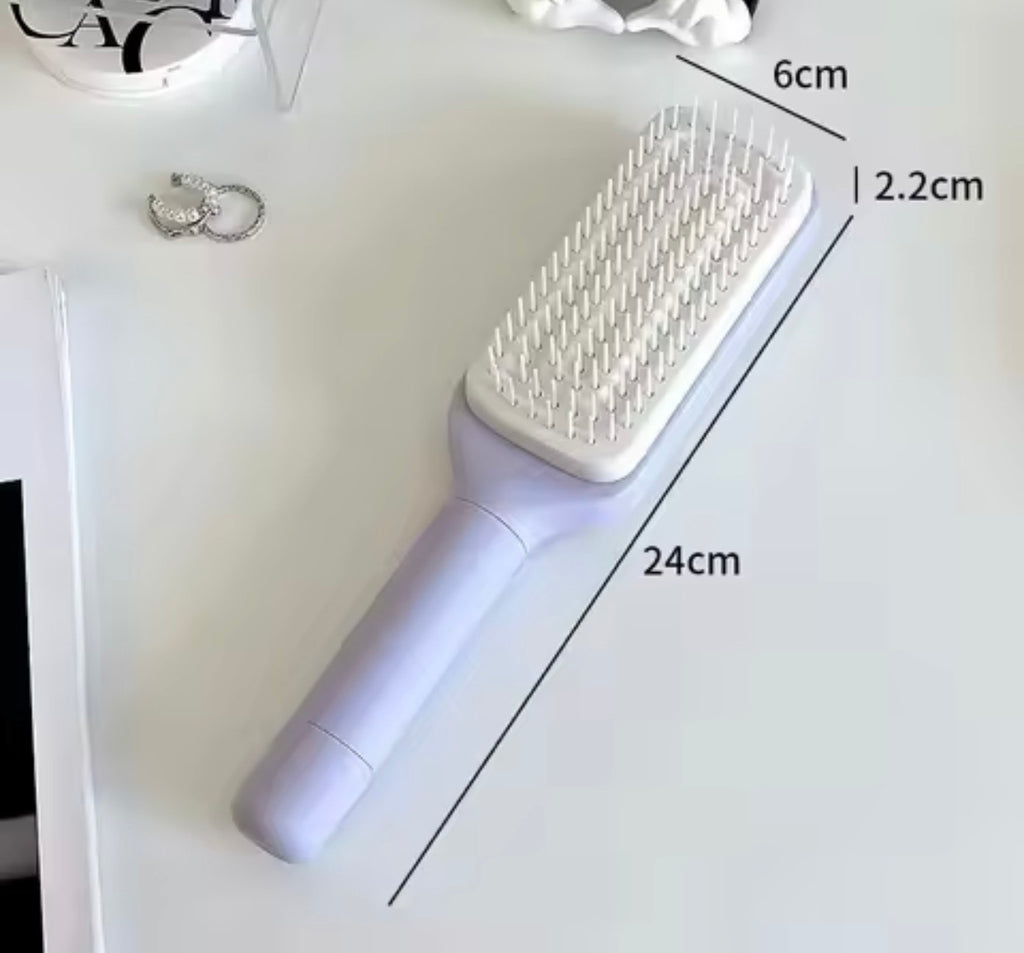 brosse à cheveux autonettoyante
